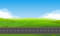 Road or highway in nature landscape with green grass, hills and blue sky. Summer or spring countryside background. Royalty Free Stock Photo